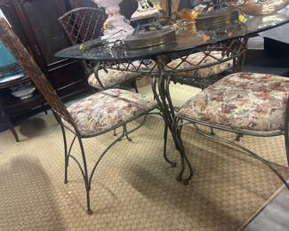 Cast iron, 4 chairs, glass top table 