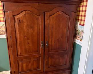 Solid wood entertainment center.