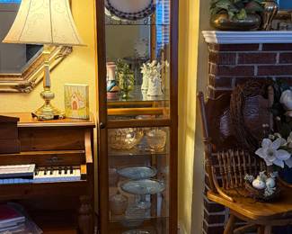 Small curio cabinet. Not lighted. Filled with vintage glassware. 