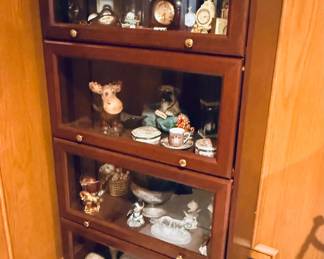 Curio Cabinet filled with nicknacks and clocks