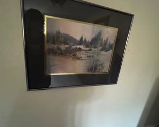 Framed watercolor landscape painting featuring a foggy forest scene, mounted with a dark mat and thin metallic frame.