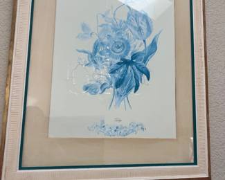 Framed botanical art print depicting blue and white flowers, double-matted under glass in a textured wooden frame.