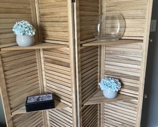 Two sided room divider with shelves