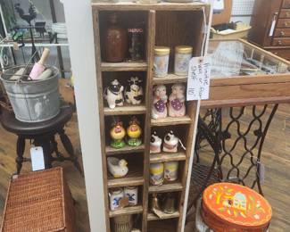 Vintage salt and pepper shakers and display cabinet