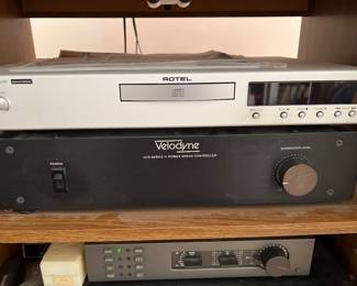Silver Rotel CD/DVD player, black Velodyne ULD amplifier, and other components