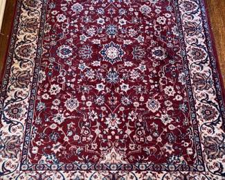 Traditional red-field area rug