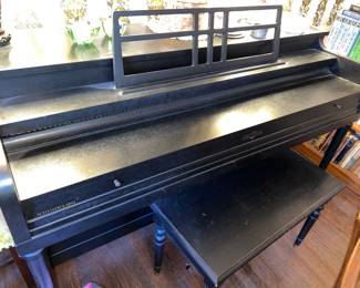 Black Wurlitzer spinet piano