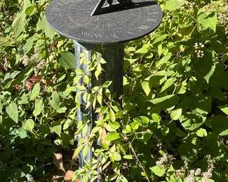 Classic outdoor garden sundial on a pedestal