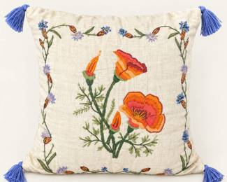 Embroidered accent pillow ◆ Orange flowers, green foliage, and blue corner tassels.