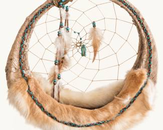 Southwestern-Style Dreamcatcher ◆ Large circular woven dreamcatcher featuring turquoise-colored beads, feathers, tan fur trim, and decorative metal accent.