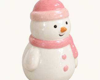 Ceramic Snowman Figurine ◆ White glazed snowman wearing a pink winter hat and matching scarf, with orange carrot nose and cheerful expression.