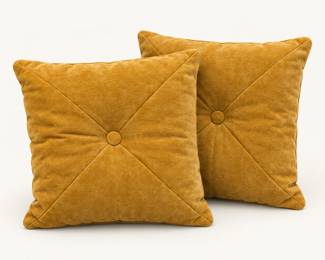 Gold Throw Pillows ◆ Two square pillows with button-tufted centers.