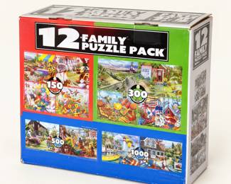 Family Puzzle Pack ◆ Box labeled with 12 puzzles in assorted designs, ranging from 150 to 1,000 pieces.