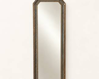 Ornate framed mirror ◆ Tall, narrow design with decorative crest and aged metallic finish.