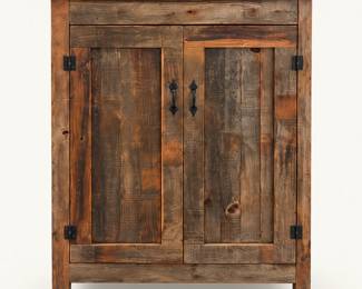 Rustic Wood Cabinet ◆ Two paneled doors with dark metal hardware.