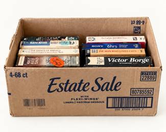 Box with: VHS tapes ◆ Assorted titles, including Victor Borge in Concert, The Man Who Loved Cats, The Dance of Angels, and The Carlyle Elements, plus a Sony recording tape. All items sold separately. 
