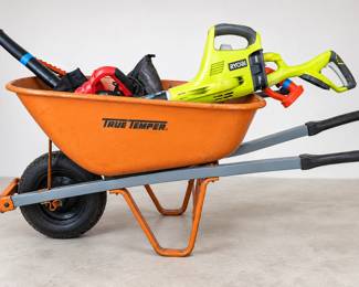 Orange Wheelbarrow Filled with Yard Tools