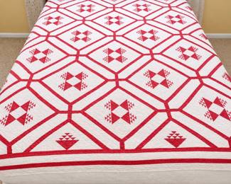 Red and White Patchwork Quilt Bed
