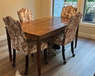 Solid walnut dining room table with four chairs. $500