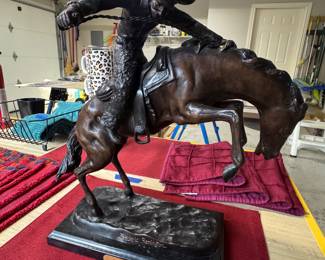 $195. Frederic Remington “Wooly Chaps” bronze reproduction
