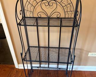 Black iron shelving…..perfect for towels or shoes or books