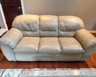 This sofa matches the chair and ottoman.  Off white leather. Presale $250