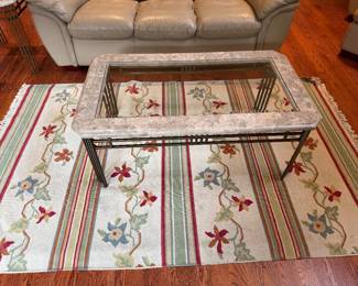 Pottery barn 5 x 8 rug in stripe and floral design.  Off white, red and green. Also includes matching marble and glass coffee table