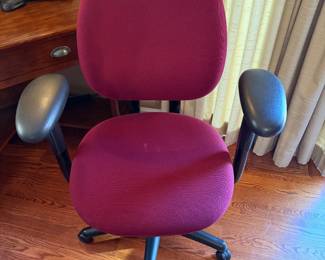 Red desk chair with castors