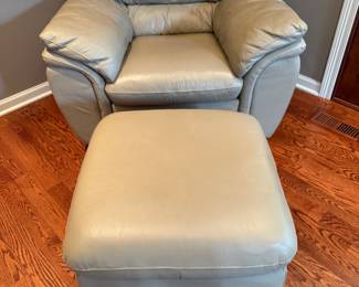 Wonderful leather chair and ottoman in off white.  Presale $185