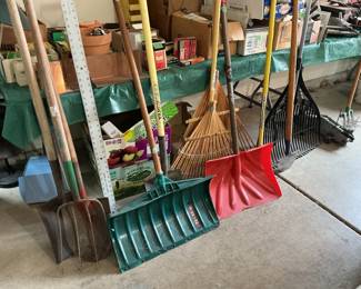 Long handled shovels, rakes and brooms