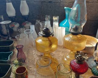 Oil lamps and many globes/ chimneys