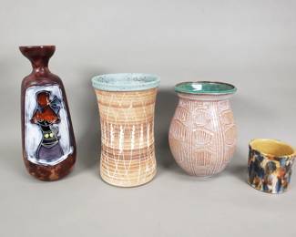 774 Lot 692 Group of vintage studio pottery leather wrapped