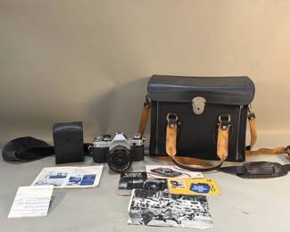 173 Lot 182 Vintage Canon AE 1 50 mm SLR film camera with