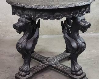 607 Lot 536 Vintage hand carved ebonized round table with