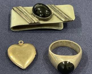 493 Lot 444h Lot of silver tone jewelry with black stone