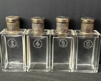 112 Lot 165 Four vintage glass perfume bottles with sterling silver tops