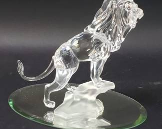 095 Lot 673 Swarovski crystal lion standing on a rock figurine
