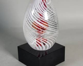 709 Lot 631 Hand blown glass paperweight on a glass base