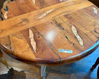 THICK MESQUITE HAND CRAFTED TABLE WITH COPPER HIGHLIGHTS AND METAL BASE.