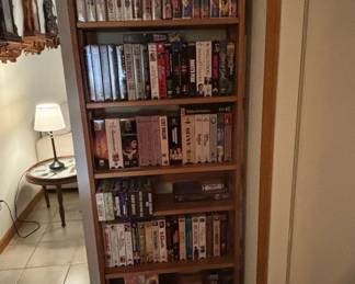 Collection of Vintage VHS Tapes on Shelving Unit
