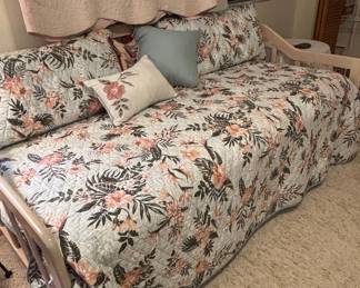 Daybed with Floral Quilt and Pillows