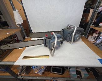 Pair of Blue Vintage Homelite C-Series Chainsaws