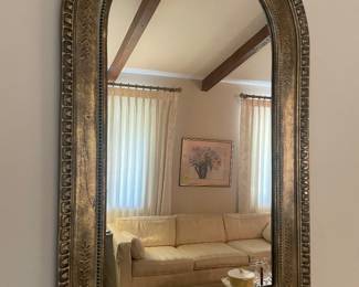 Antique style arched wall mirror with gold finish border and beaded inner border . 45 inches tall and 28 inches wide