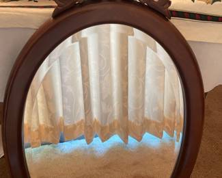Bombay Company Cherry/Mahogany Oval beveled wall mirror. 33 1/2 inches high and 18 inches wide