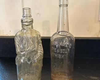 132 pairofvintageembossedglassbottles