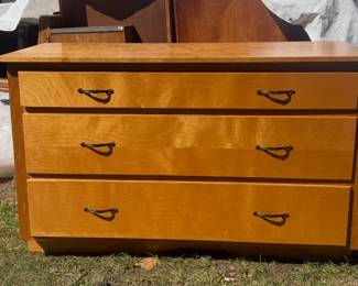 This midcentury dresser has a smaller brother inside the house!