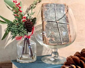 ($6 - Berry pinecone cedar in vase - 10” tall) ($14 - Glass brandy snifter - 9” tall) ($18 - Antique books - 6.5x4.5)