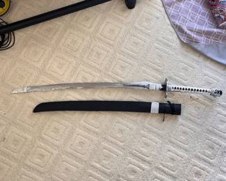 Sword with silver, leather handle and sheath