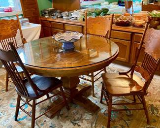 Glass top, oak table with 4 spindle back chairs 