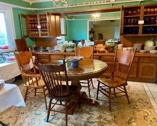 Glass top, oak table with 4 spindle back chairs 